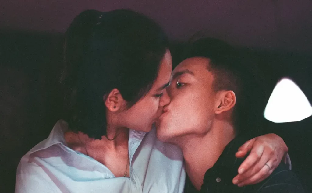 An asian couple kissing